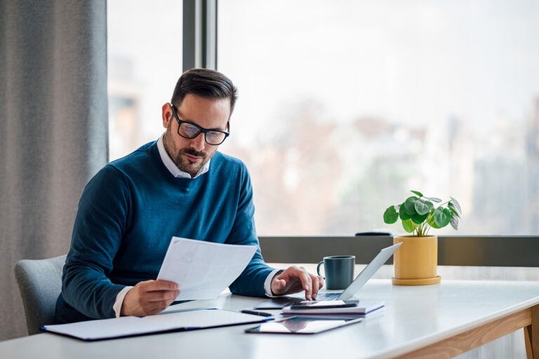 Man in office reviewing documents